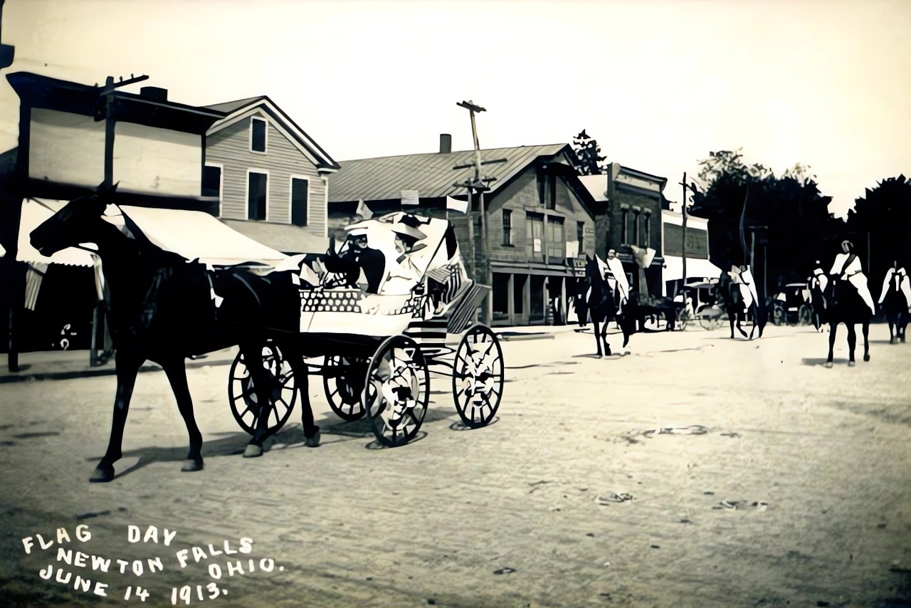 1913 Flag Day Parade on Broad Street. The large building in the center was Cory Hardware's (1st store) and C.M. Hoffman Fine Harness.