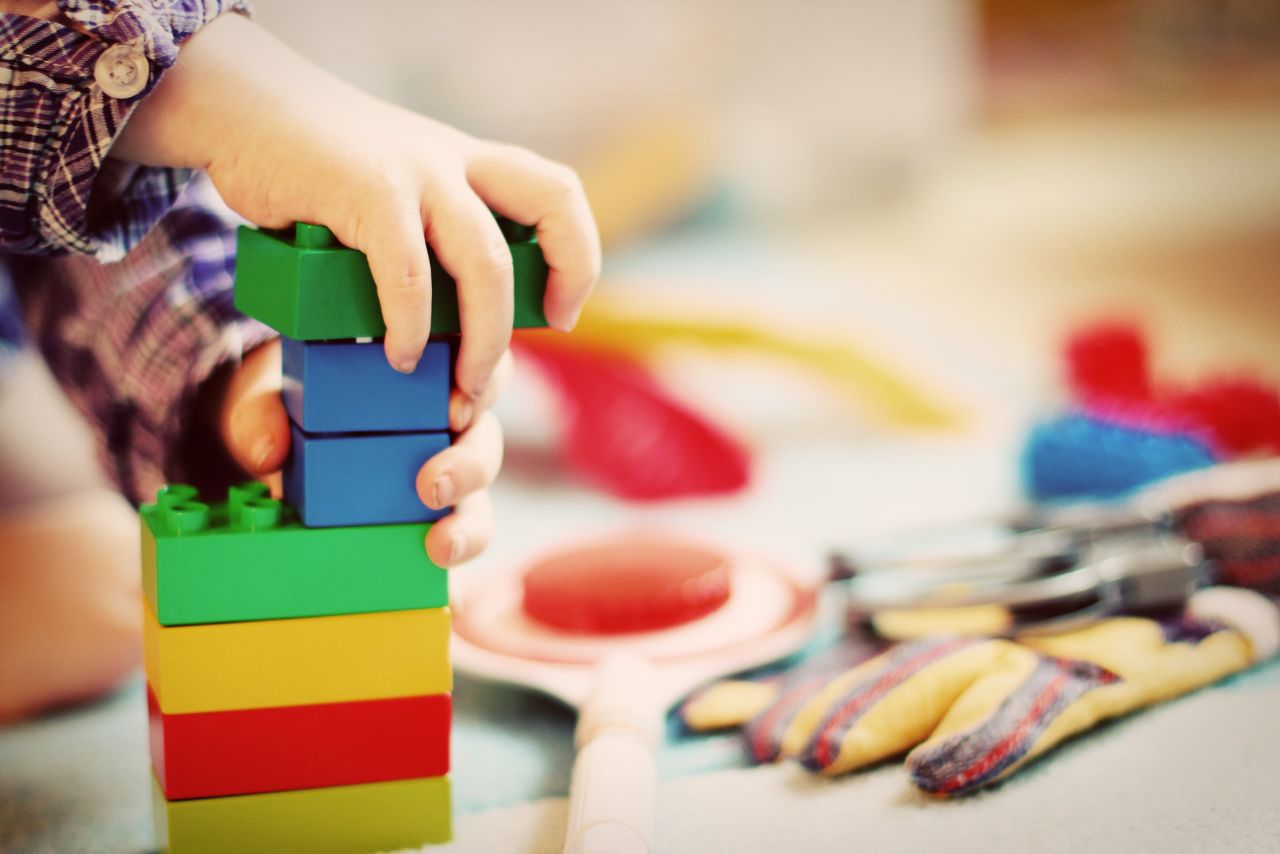 Child stacking blocks.