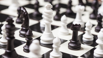 Chess pieces on a board.